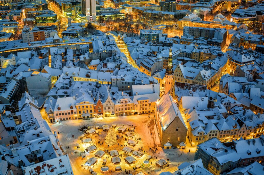 Festive scene from the Tallinn Christmas Market 2024 showcasing holiday lights, stalls, and winter atmosphere