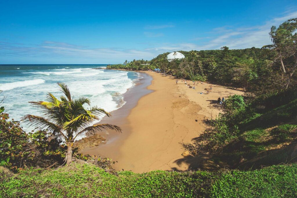 a beach with waves crashing on the shore